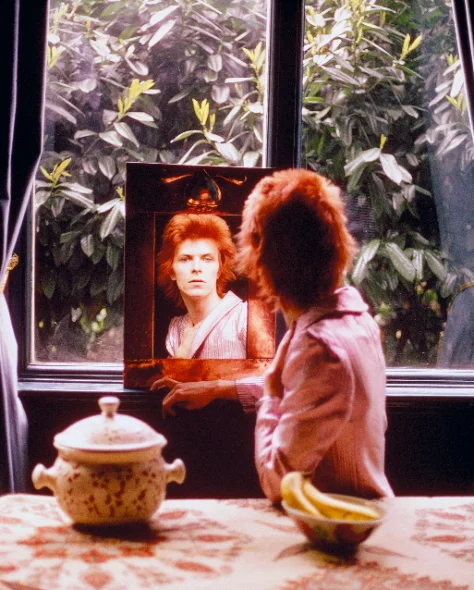 David Bowie, Ziggy Stardust — mirror portrait, 1972–1973. Photograph by Mick Rock.